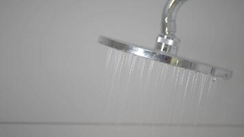 A CloseUp of a Modern Shower Head Featuring Flowing Water for a Relaxing Bath Experience video