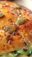 A Freshly Baked Soft Bread Roll Topped with Seeds and Vegetables video
