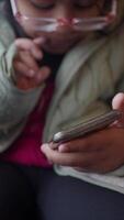 A Childs Hand Skillfully Using a Smartphone with a Focused and Engaging Gesture video