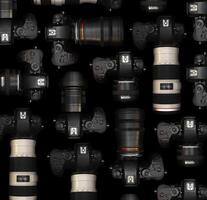 Mirrorless Cameras with different lenses for shooting videos. Top view of digital cameras isolated on black background. Photography pattern design. photo