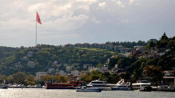 turkey istanbul 23 november 2024, A Beautiful Scenic View of a Flag on a Hillside Overlooking the Marina video