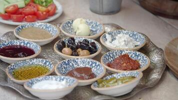 Assorted Dips and Condiments in Decorative Bowls on a Serving Tray video
