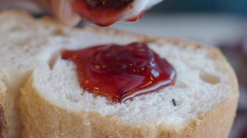 Spreading Jam on Fresh Toast at a Caf video