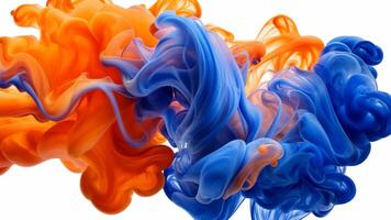 Abstract shapes formed and teal ink blending orange and blue ink in water on a white background video