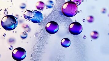 Drops of ink Colorful bubbles of varying sizes float and move, creating a dynamic and visually appealing scene with a soft white background video