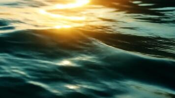 Golden sunset light reflecting on a gently moving water surface, creating beautiful bokeh and highlights background video
