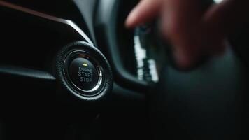 Pressing Stand By Power Button To Turn On and Off the Electric Car. Pushing start stop Button to start keyless ignition hybrid car electro engine. Starting car engine. Button to start the car engine. video