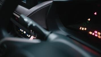 Dashboard in the electric car. Many different electric car dashboard lights with warning lamps illuminated. Starting electric car engine. Tachometer Gauge of Starting and Stopping Car. Free Copy space video
