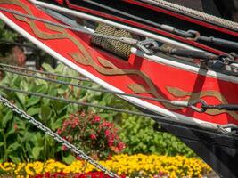 A close up of a ship with flowers in the background photo