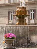A fountain with a large water spout photo