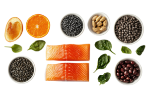 Fresh salmon fillets arranged with nuts, seeds, fruits, and greens on a bright background for healthy meal preparation png