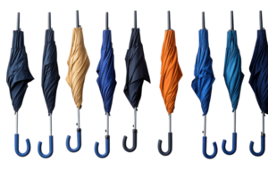 Colorful collection of umbrellas hanging in a row against a white backdrop in a retail display setting png