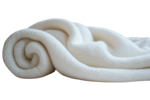 Soft and cozy white fleece blanket casually rolled up on a surface in a warm, inviting space suitable for relaxation png