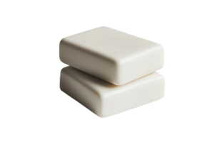Simple white soap bars stacked on top of each other against a neutral background for minimalistic design png