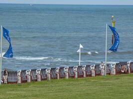 A row of chairs on the beach photo