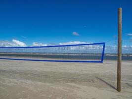 A volleyball net on the beach of norderney photo