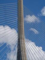 A bridge with a clock tower photo