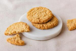 Oatmeal cookies on a marble stand photo