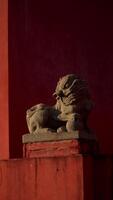 Ornate stone lions guarding the entrance of a temple. photo