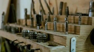 Various tools. file, screwdriver, hammer, pliers, garden tools are displayed on wooden shelf inside rustic garage or manufactory, workshop studio in a rustic garden house. Hobby, leasure activity. High quality photo