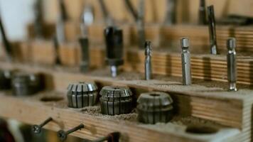 Various tools. file, screwdriver, hammer, pliers, garden tools are displayed on wooden shelf inside rustic garage or manufactory, workshop studio in a rustic garden house. Hobby, leasure activity. High quality photo