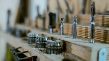 Various tools. file, screwdriver, hammer, pliers, garden tools are displayed on wooden shelf inside rustic garage or manufactory, workshop studio in a rustic garden house. Hobby, leasure activity. High quality photo