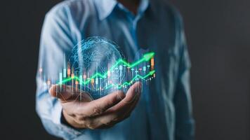 Business online digital market management. man hold graphs to report and progress of business and analyze finances, and investments. Use technology to plan strategy to success goals and growth stock. photo
