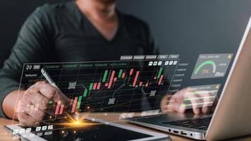 Business online digital market. businessman use graphs report and progress of business and analyze financial,and investment. Use technology to plan strategy to success goals and growth stock. photo