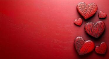 A red background with a row of red hearts. The hearts are arranged in a row and are all facing the same direction photo