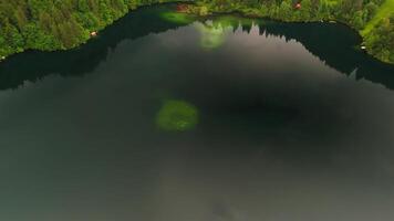 Drone views of Freibergsee and Heini-Klopfer- Schkiflugschanze in Bavaria, Germany. Surrounded by mountains and forests, this pristine lake and famous ski jump is an aerial view of area. Oberstdorf. video