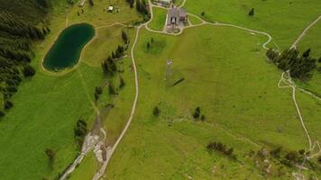 Aerial view Nebelhorn snowmaking pond in Oberstdorf collects water for artificial snow, supporting skiing activities despite variable natural snowfall. Supporting sustainable snow coverage in Alps. video