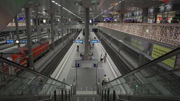 December 24, 2023. Berlin, Germany. Berlin hauptbahnhof gleis. Berlin Main Station Interior inside on platform. Central railway terminal inside on railroad tracks. Head railroad depot view of track. video