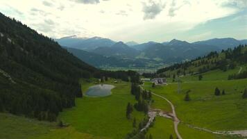 Aerial view Nebelhorn snowmaking pond in Oberstdorf collects water for artificial snow, supporting skiing activities despite variable natural snowfall. Supporting sustainable snow coverage in Alps. video