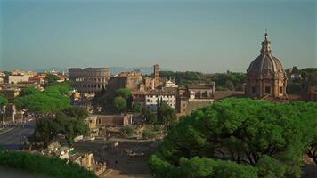 Overhead view of Rome city and coliseum from observation deck Atrio della liberta. Rome skyline and Colosseum from viewing point Piazza Venezia. Top view of Rome city with Colosseum and Roman Forum. video