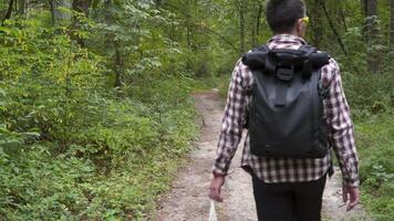 Young man throwing litter garbage from plastic bag on ground. Environmental pollution. Global warming. Male throwing out garbage in forest. Ecological issue. Throw trash anywhere. Contaminated soil. video