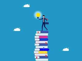businessman on top of stack of books with light bulb vector