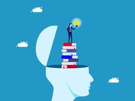 businessman standing on top of a stack of books with a light bulb above it vector