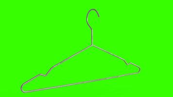 clothes hangers with green background photo