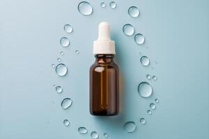 Amber bottle with dropper, water droplets, light blue background suggests freshness photo