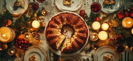 Christmas cake taking center stage on festive dinner table photo