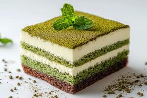 Delicious matcha tiramisu cake decorated with fresh mint leaves and cocoa powder photo