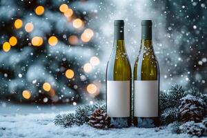 Two wine bottles with blank labels standing in snow with christmas tree lights in background photo