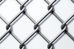 Close-up of metal chain link fence creating diamond pattern on white background photo