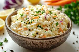 Creamy coleslaw with cabbage, carrots, and parsley sprinkled with black pepper photo