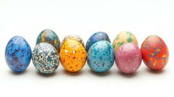 Twelve colorful hand-painted easter eggs forming a square on white background photo