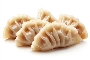 Steamed gyoza dumplings resting on white background photo