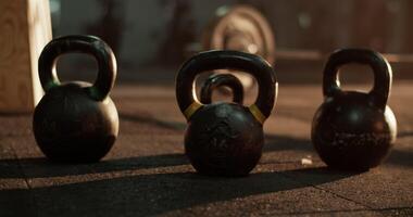 Kettlebells placed in line on floor in daylight video