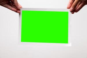 Photo frame mockup on white wall background. Large printed photo with borders on edges