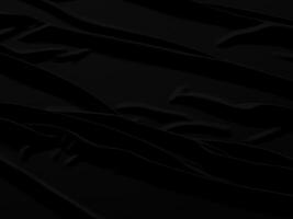 Black fabric background with waves and folds photo