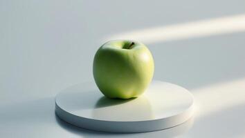 A green apple is sitting on a white surface photo